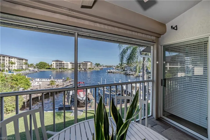 Unfurnished sunroom with plenty of natural light and a water view