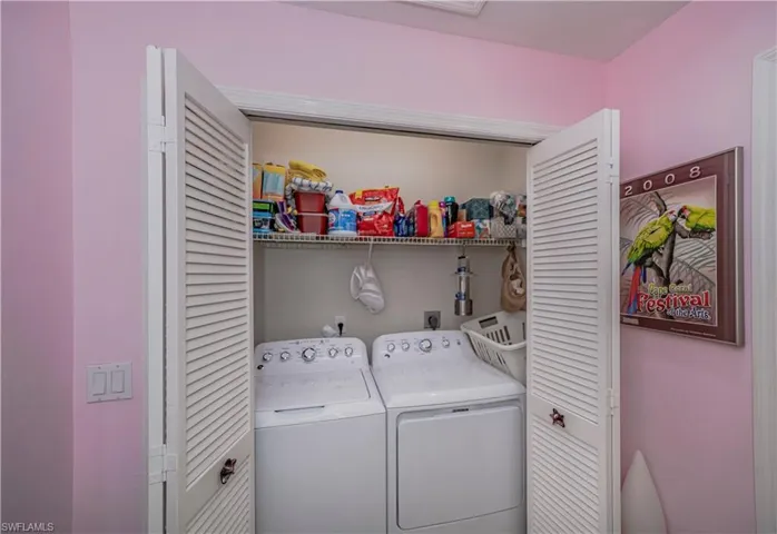 Washroom with washing machine and dryer and electric dryer hookup