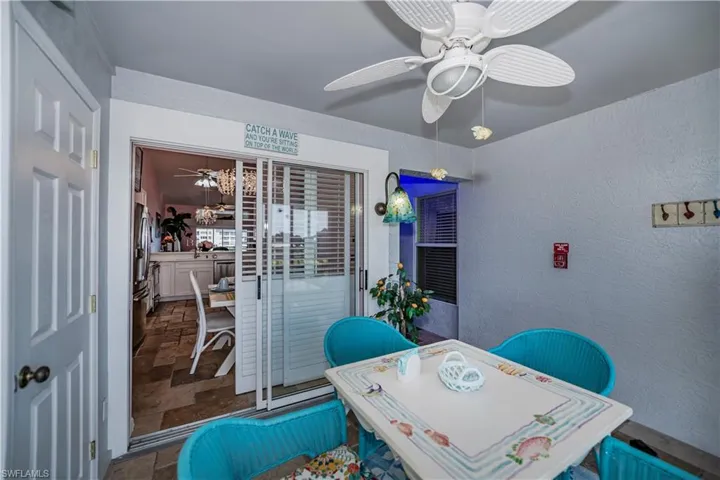 Tiled home office featuring ceiling fan