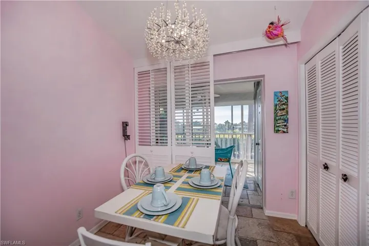 Tiled dining room with an inviting chandelier