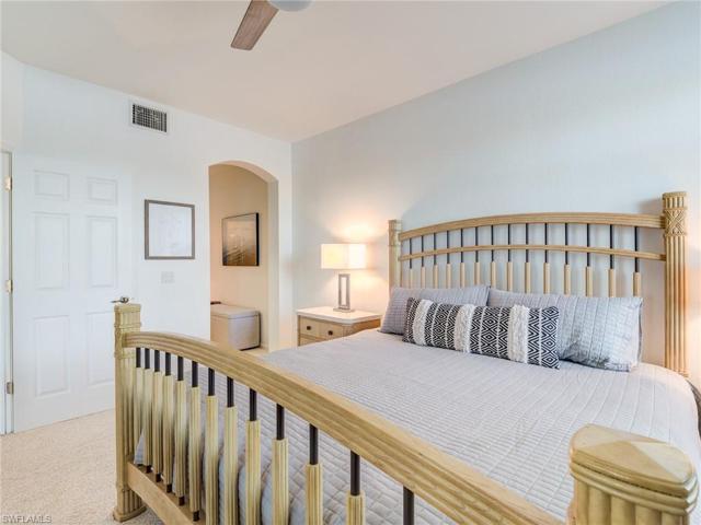Hallway at rear leads to walk-in closet and en-suite bath