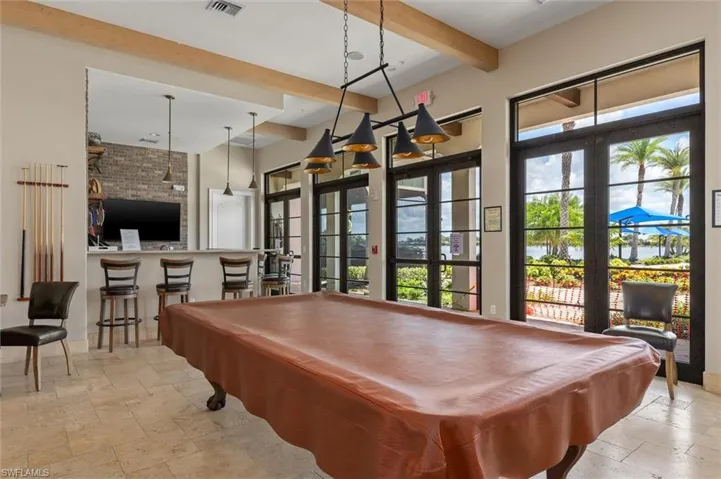 Spacious common area featuring a billiards table