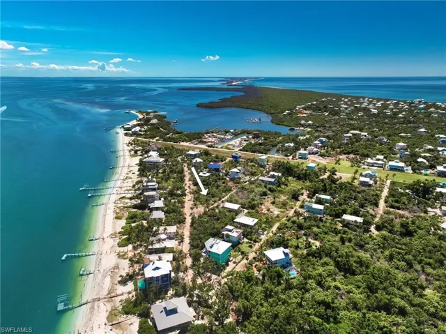 Bird's eye view featuring a water view and a view of the beach