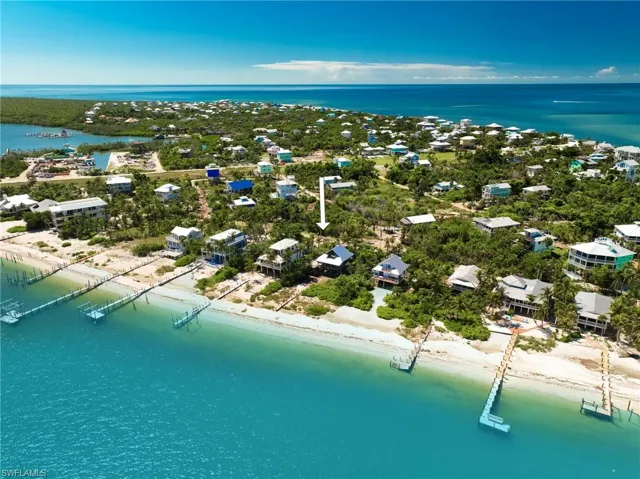 Drone / aerial view featuring a view of the beach and a water view