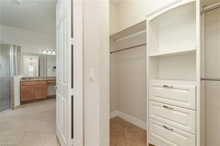 One of 2 walk in closets in owners suite