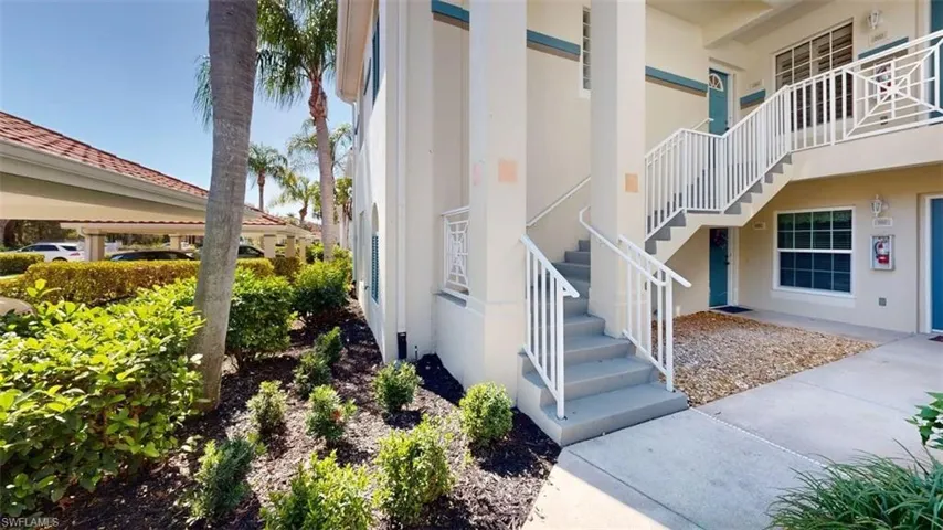 Doorway to property featuring stucco siding