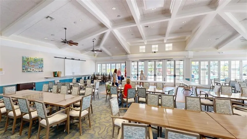 Dining area featuring a barn door, recessed lighting, and a ceiling fan