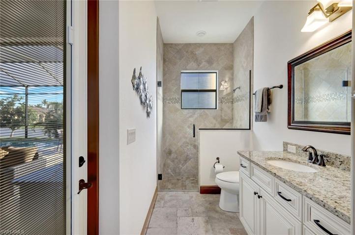 Guest bath doubles as pool bath.