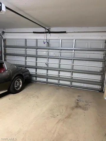Two car garage with automatic door opener and hurricane impact garage door