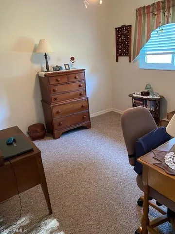 Third bedroom with walk-in closet utilized for wife's hobby/craft room.