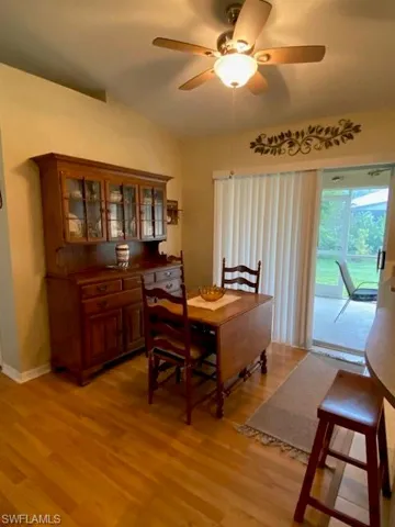 Sliding doors lead to screened lanai and back yard