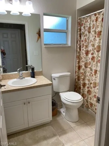 Guest bathroom with combination tub & shower