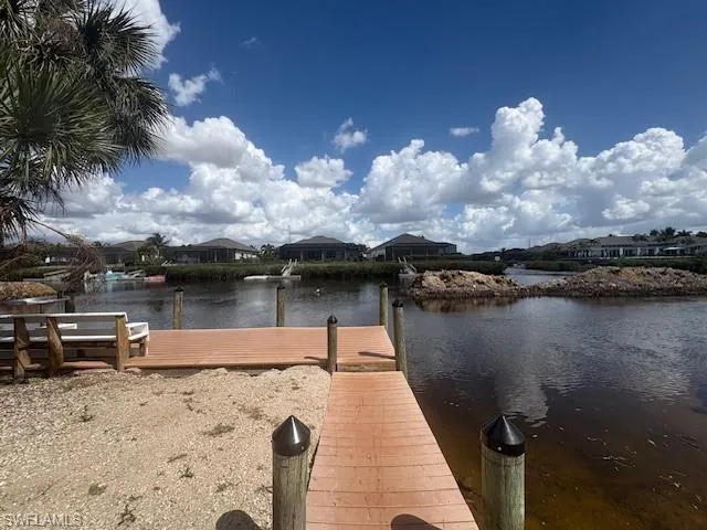 Dock area featuring a water view