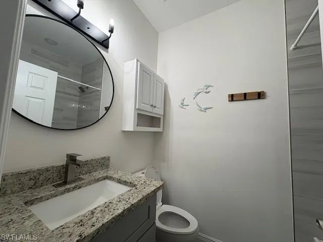 Bathroom with vanity and a shower
