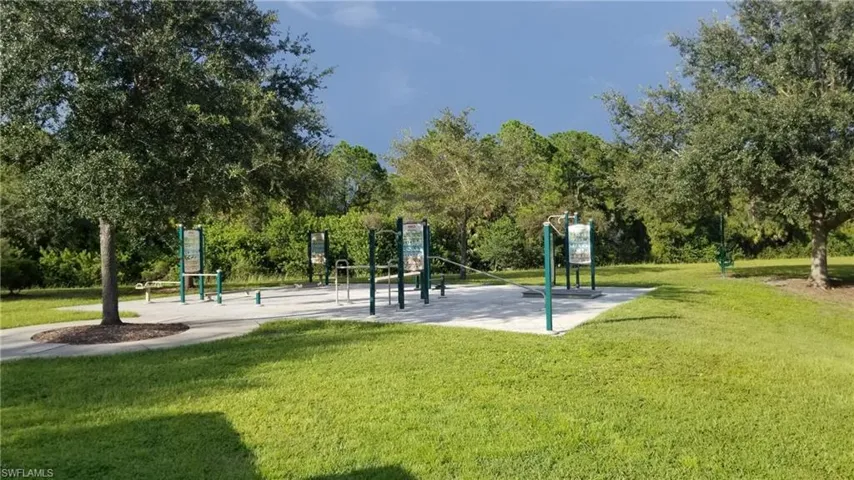 Surrounding community with a playground and a lawn