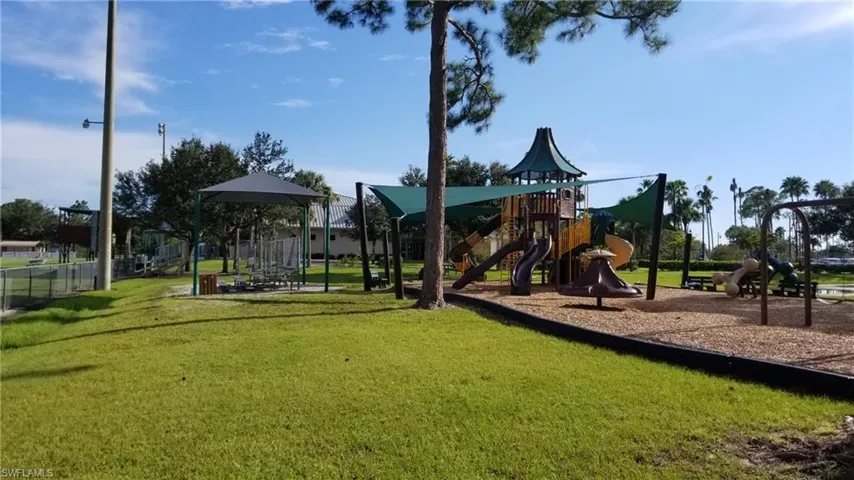 View of jungle gym with a yard