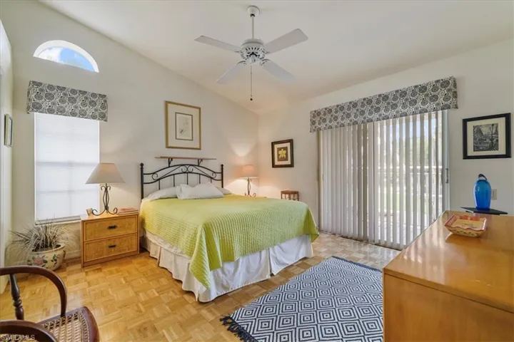 Bedroom featuring vaulted ceiling and ceiling fan