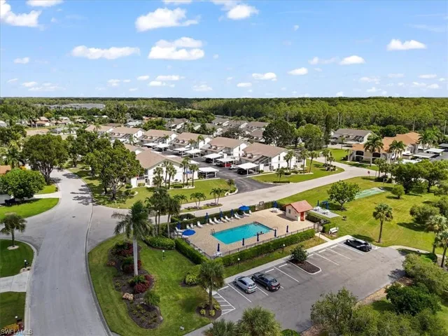 Aerial perspective of suburban area with a pool area