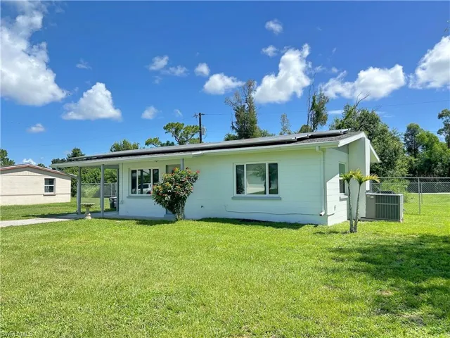 View of front of property with a front lawn