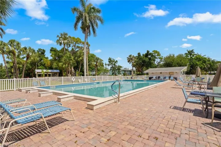 Community pool with large deck area for relaxation.