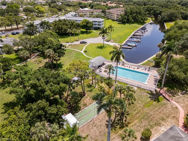 Bird's eye view of shuffle board courts, pool and Gulf Access Canal.