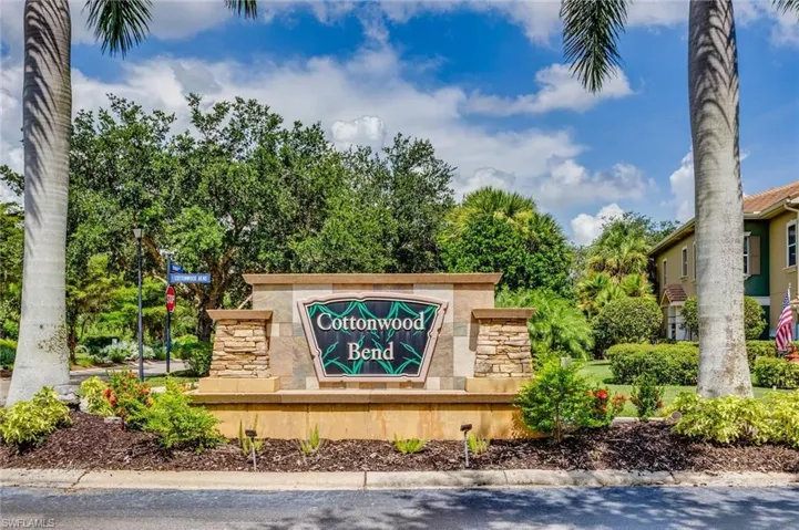 Community entrance monument featuring stacked stone accents and integrated signage