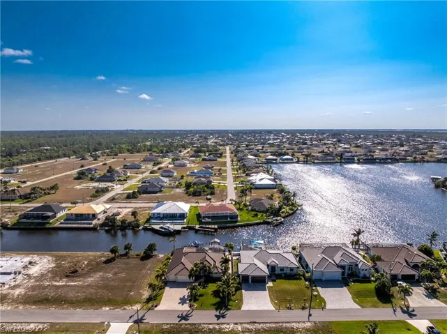 Aerial perspective of suburban area with a nearby body of water