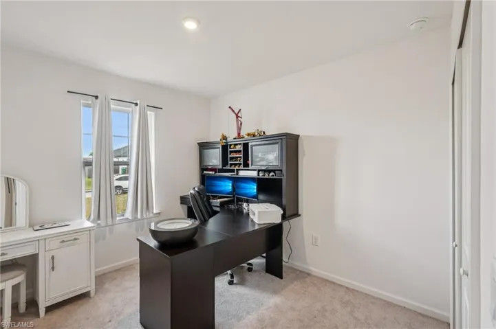 Office with light colored carpet