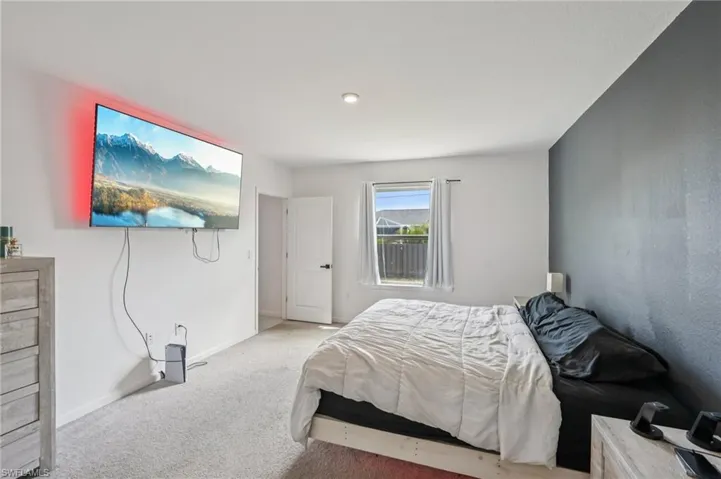 Bedroom with carpet and baseboards