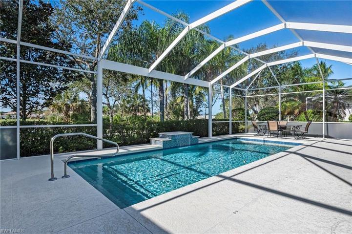 28353 Moray Dr Bonita Springs FL 34135 - Let the waterfall feature relax you while you enjoy a book on the lanai