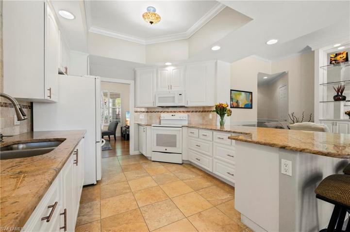 28353 Moray Dr Bonita Springs FL 34135 - Kitchen has access from both living areas