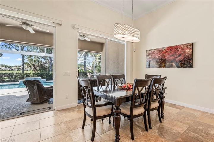 28353 Moray Dr Bonita Springs FL 34135 - Dining area with expandable table overlooks the outdoor living area