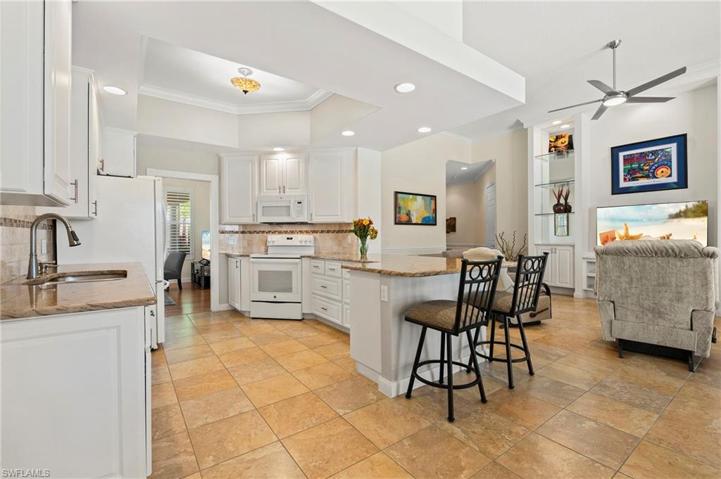 28353 Moray Dr Bonita Springs FL 34135 - Modified kitchen layout is open to the family room