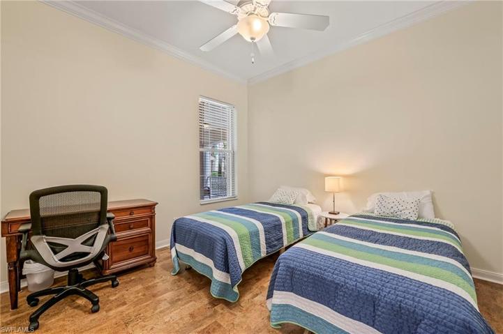 28353 Moray Dr Bonita Springs FL 34135 - Bedroom 2 features a cork floor and twin beds