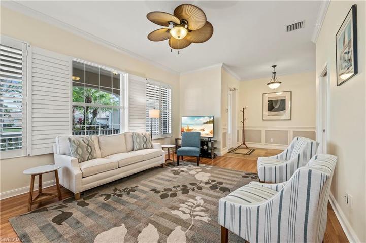 28353 Moray Dr Bonita Springs FL 34135- Living room with crown moulding plantation shutters