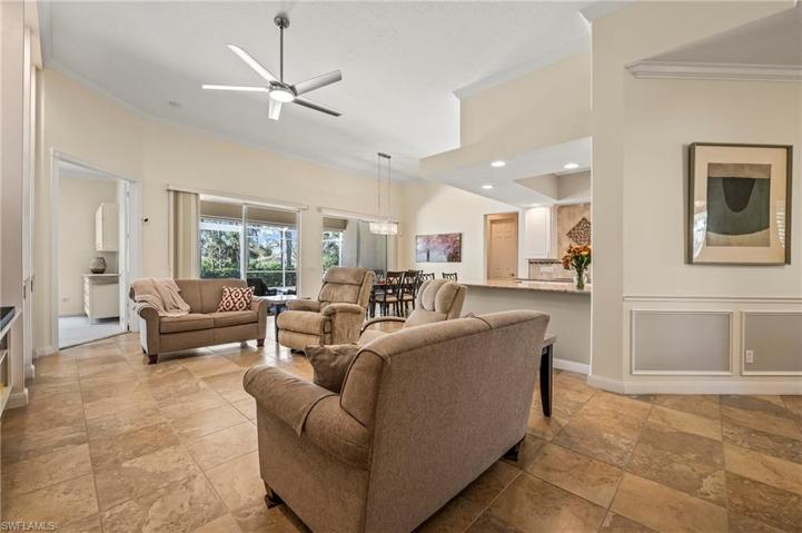 28353 Moray Dr Bonita Springs FL 34135 - Foyer and hallway feature chair rail and picture frame moulding.