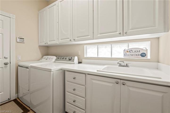 28353 Moray Dr Bonita Springs FL 34135 - Laundry room has utility sink and ample storage