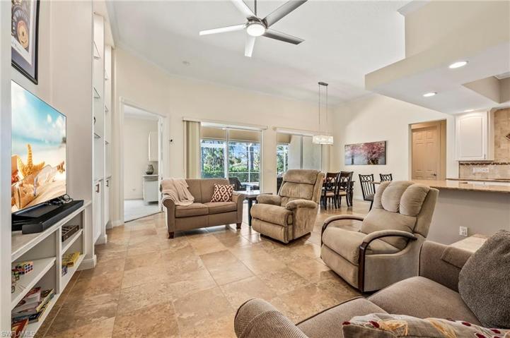 28353 Moray Dr Bonita Springs FL 34135 - Modified entertainment center offers a scaled back profile and additional shelving under television