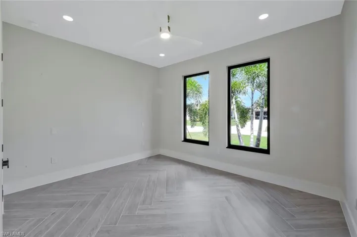 Empty room featuring recessed lighting and ceiling fan
