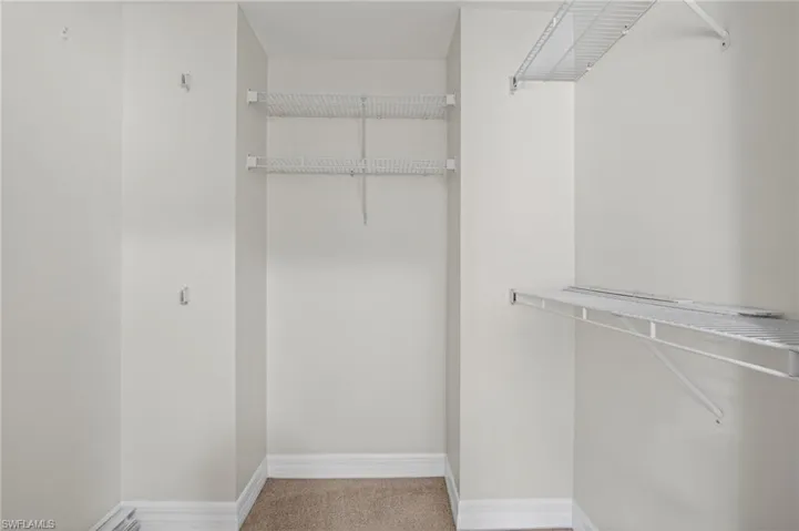 Spacious closet with built in racks for storage