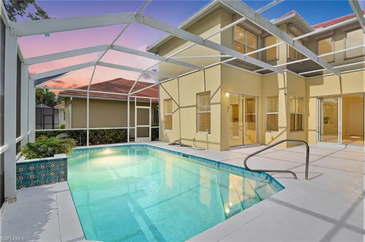 Outdoor pool featuring a sunroom, a lanai, and a screened in patio area