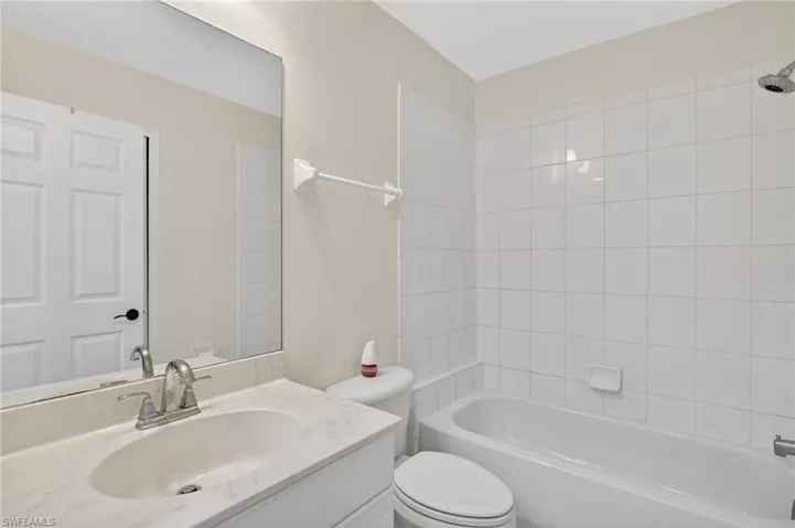 Full bathroom featuring vanity and shower / washtub combination