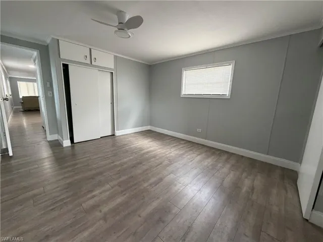 Bedroom with 2 closets, built in chest & back door access