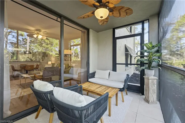 Sunroom / solarium with a ceiling fan and an outdoor lounge area