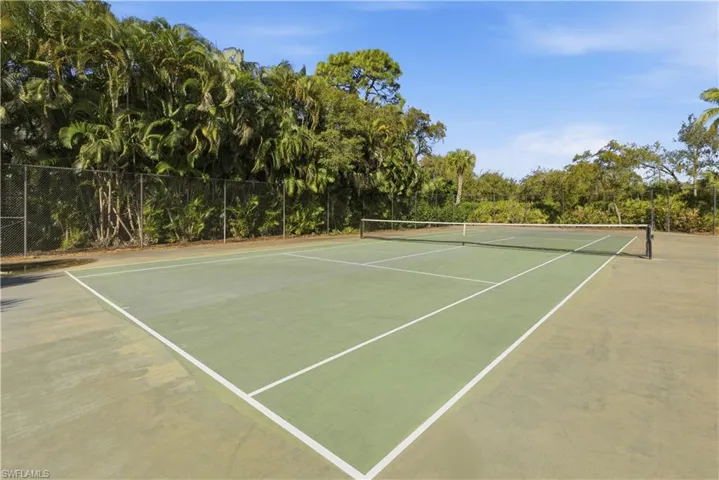 View of tennis court with community basketball court