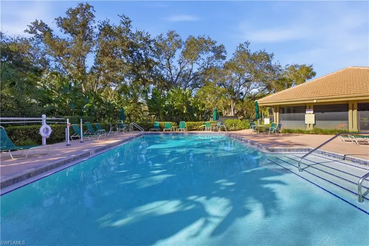 Community pool with a patio area