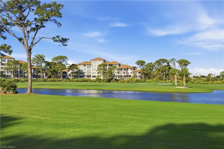 Surrounding community featuring a water view and golf course view