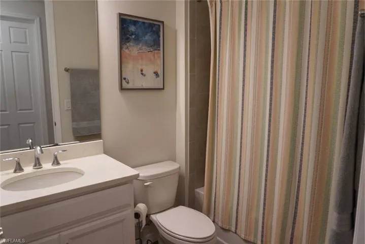 Full bath with vanity and shower / bathtub combination with curtain