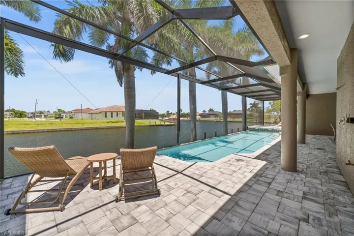 Pool area with giant pool, spa and plenty of lounging area.
