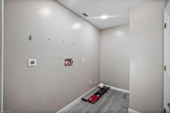 Clothes washing area with hookup for an electric dryer and hardwood / wood-style flooring